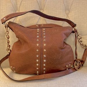 MK leather bag with gold rivets and trim